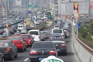 Freeway traffic in Shanghai at midday is a visible of China's growing economy.